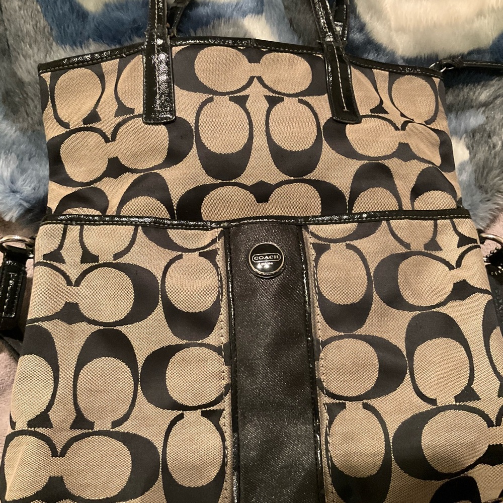 Signature black and gray bag! See photos of strap handle sign of wear. Great bag